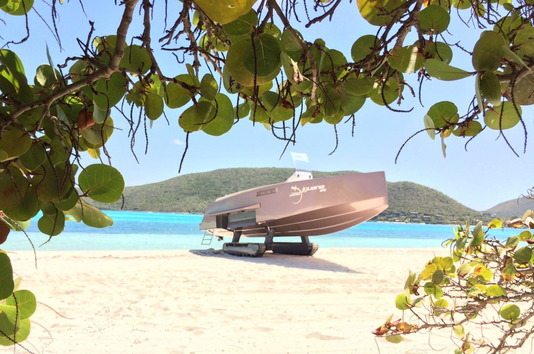 Amphibious boat with tracks on the beach