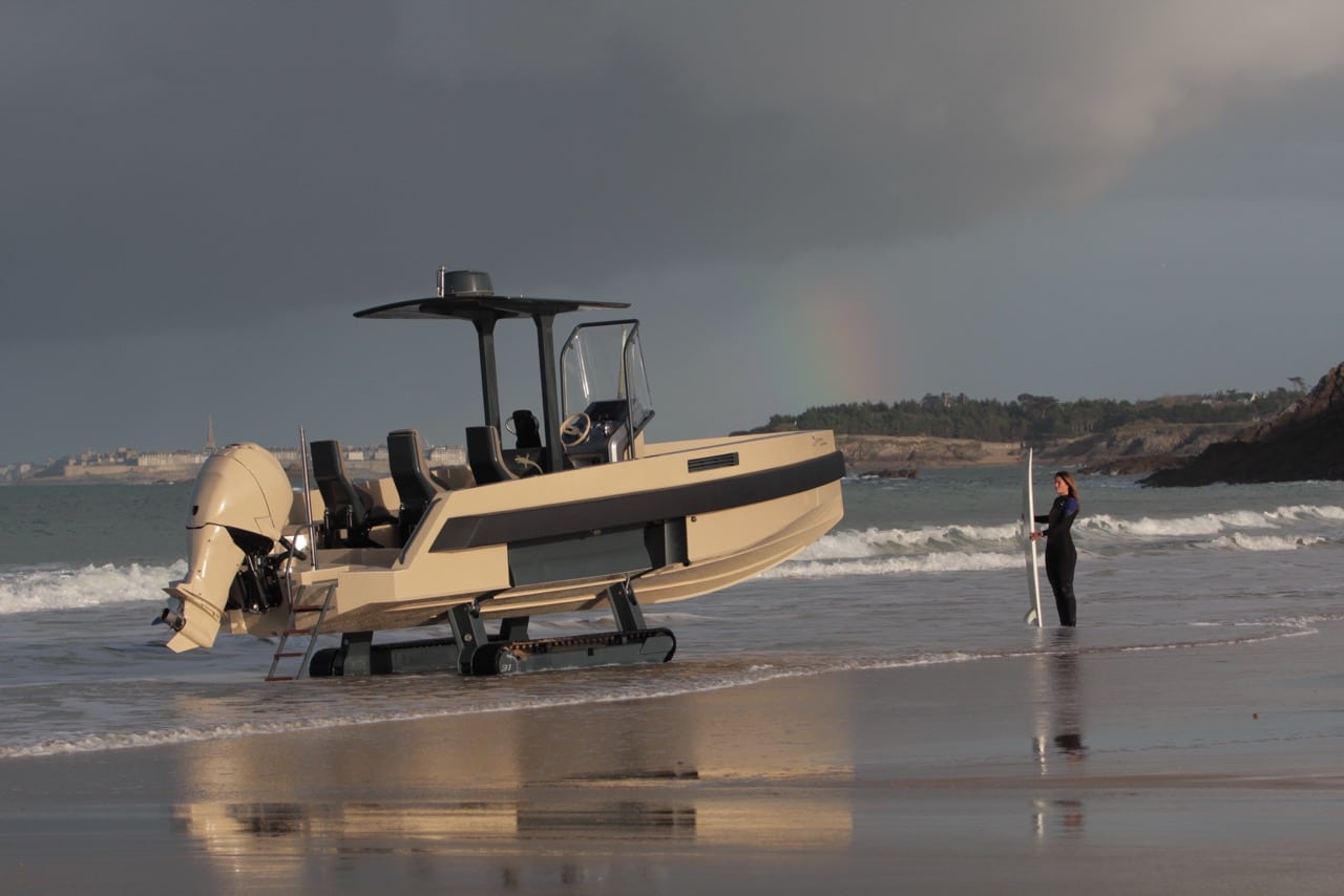 Iguana amphibious boat with tracks on the beach