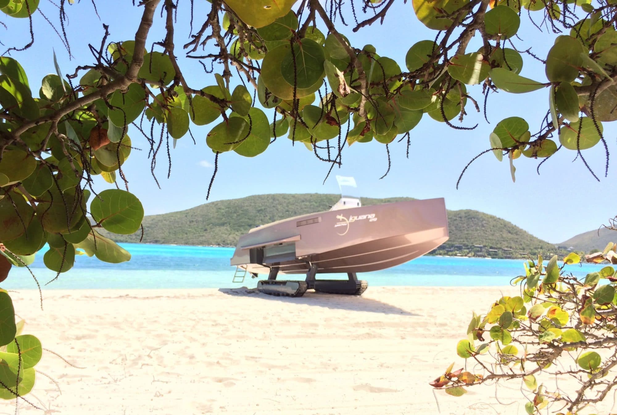 Amphibious boat with tracks on the beach